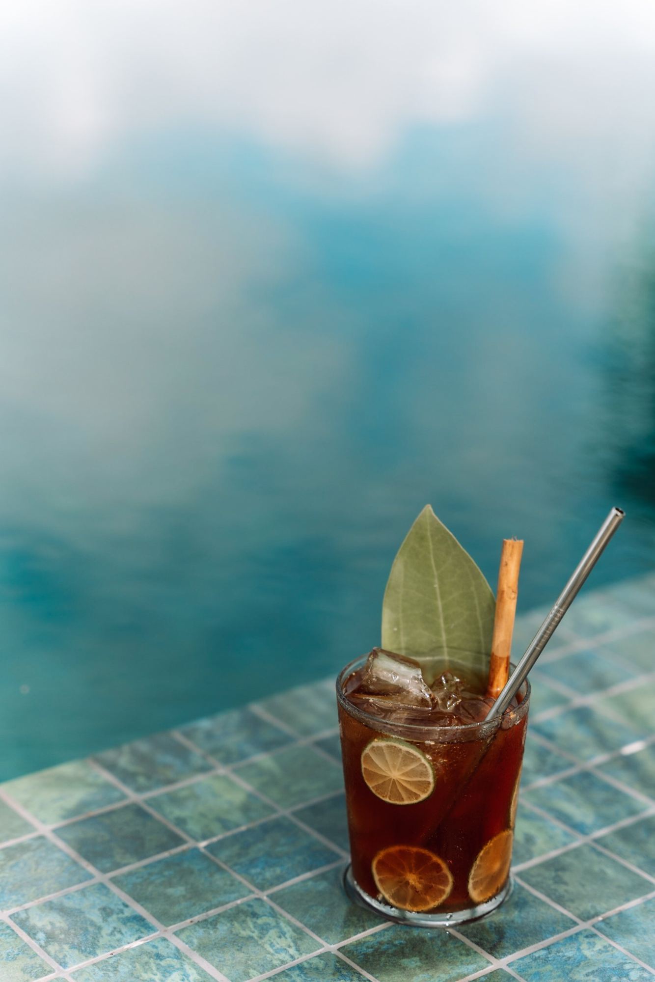 A cooling drink by the pool at golden hour