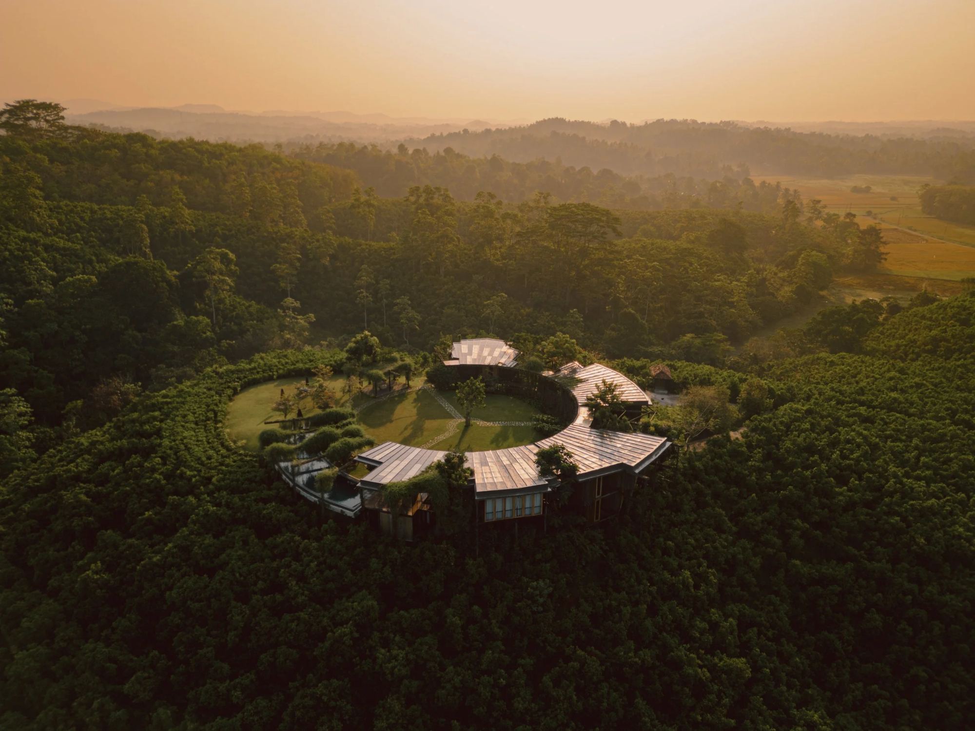 The Round House at golden hour above the paddy fields